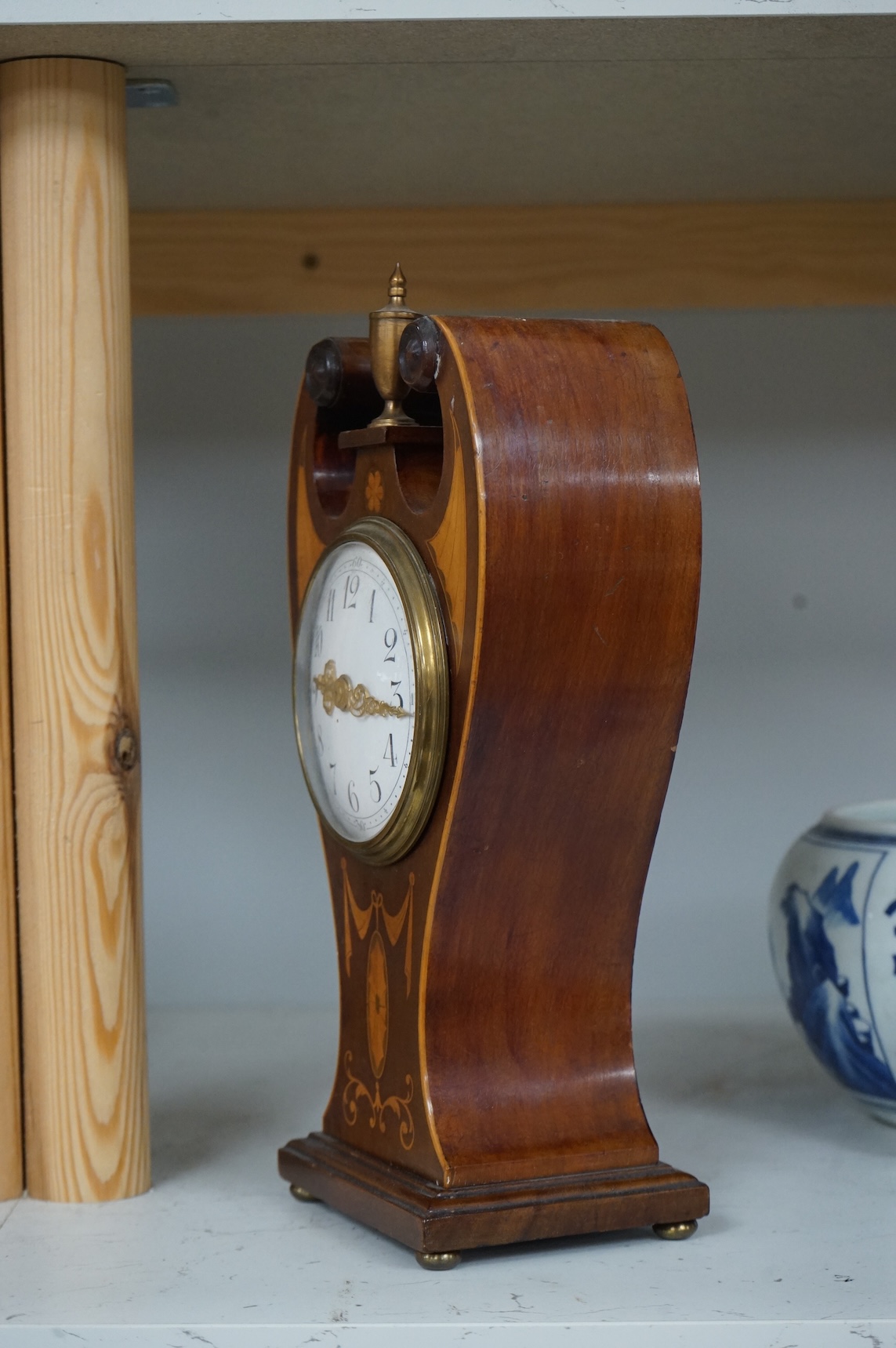 An Edwardian inlaid mahogany mantel timepiece, 28cm high